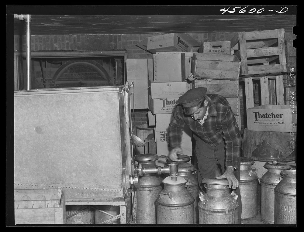 [Untitled photo, possibly related to: Milk cans at the United Farmers' cooperative creamery]. Sourced from the Library of…