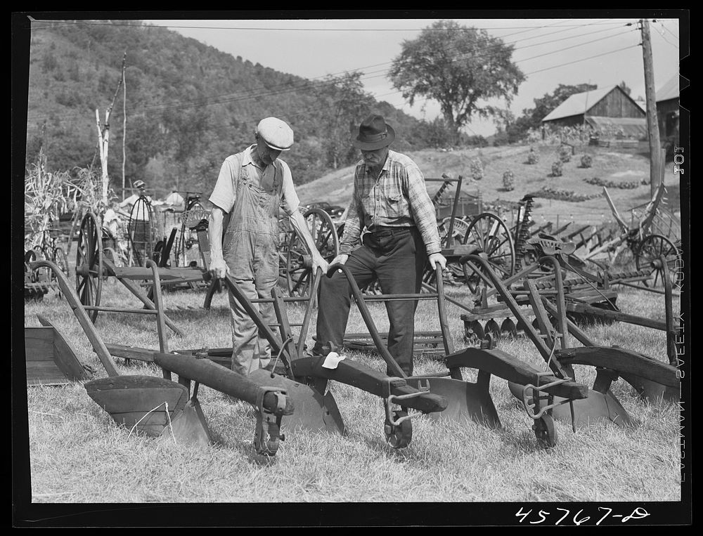 Farmers at the exhibit of old ploughs and farm implements at the World's Fair in Tunbridge, Vermont. Sourced from the…