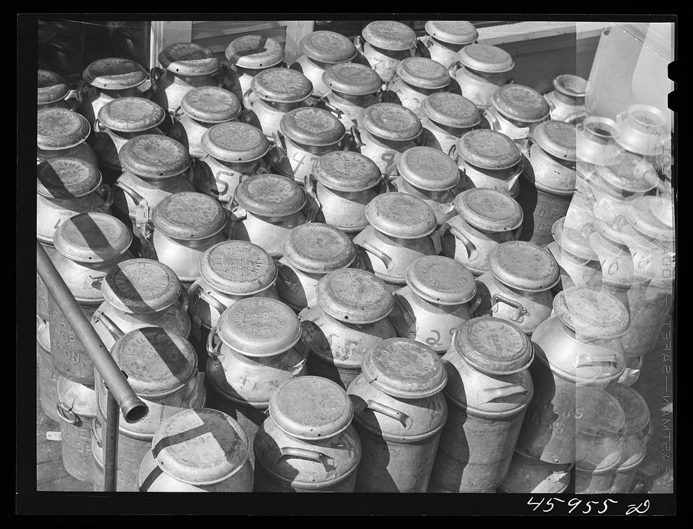 Milk cans at the United Farmers' Co-op Creamery in East Berkshire, Vermont. Sourced from the Library of Congress.