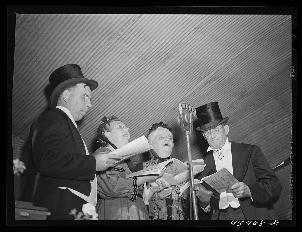 The quartet sings a selection at an old-fashioned musical at the "World's Fair" in Tunbridge, Vermont. Sourced from the…