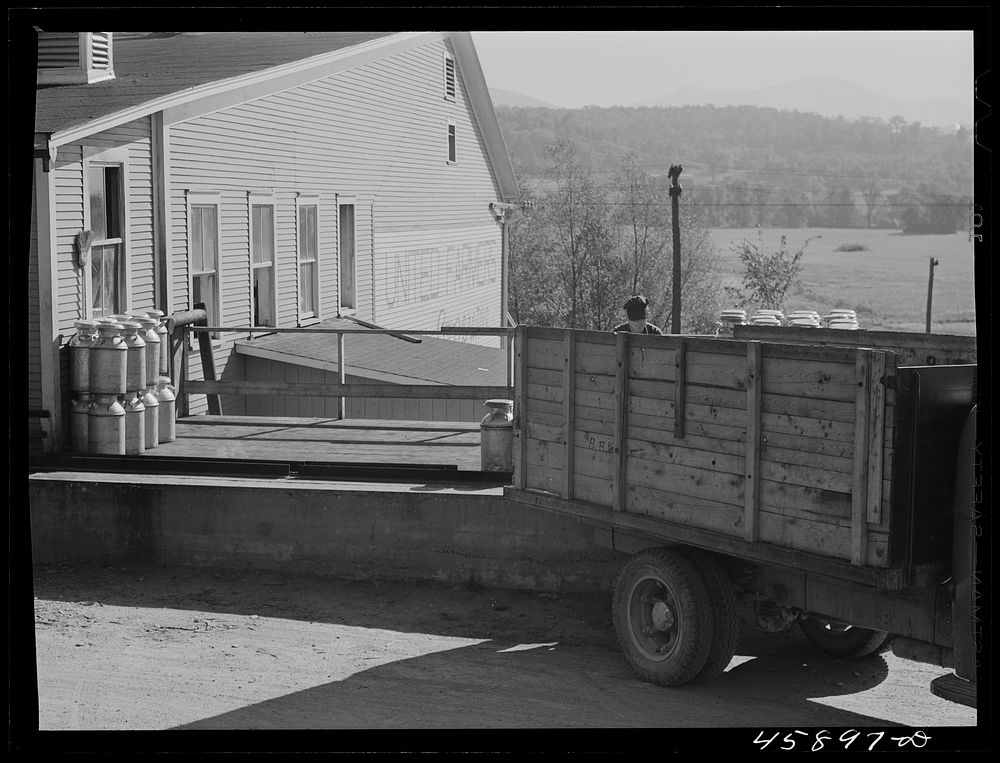 [Untitled photo, possibly related to: Farmer unloading milk cans at the United Farmers' Co-op Creamery. East Berkshire…