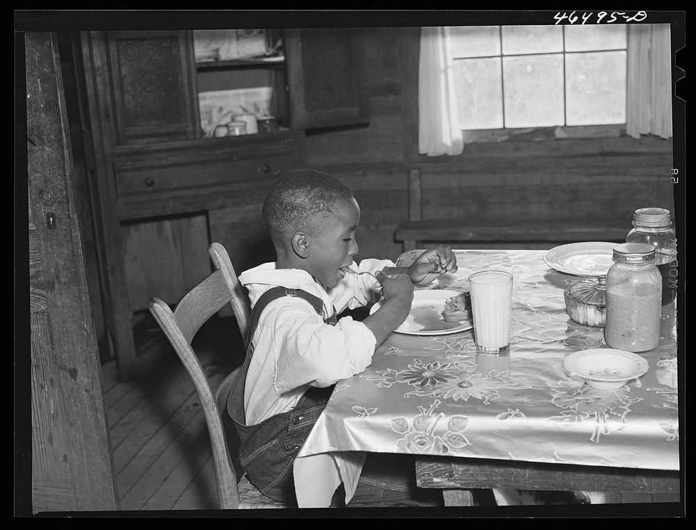 [Untitled photo, possibly related to: Boyd Jones eating his breakfast, Greene County, Georgia]. Sourced from the Library of…