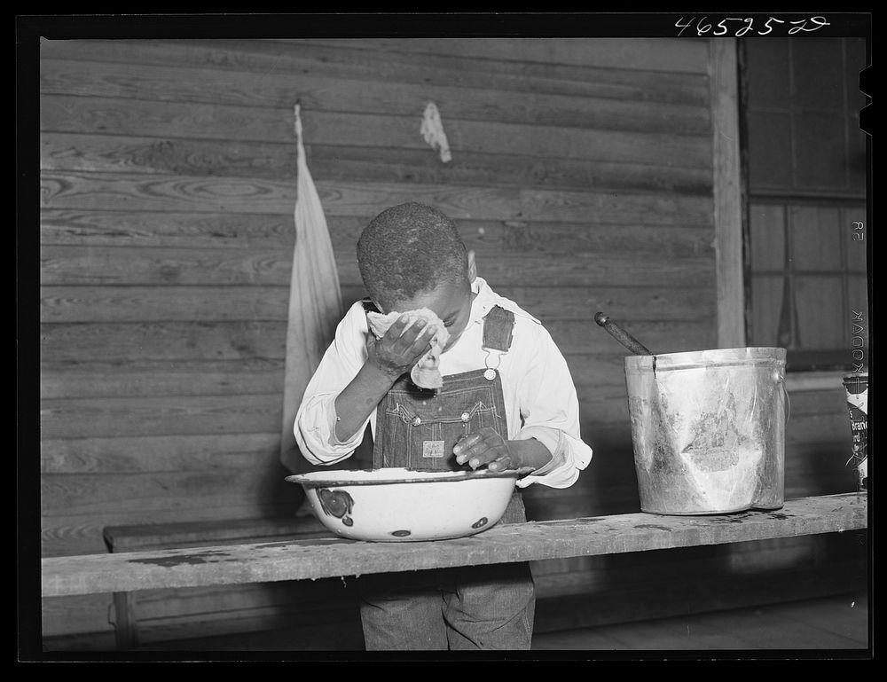 [Untitled photo, possibly related to: Boyd Jones washing his face on the back porch of his house, Greene County, Georgia].…