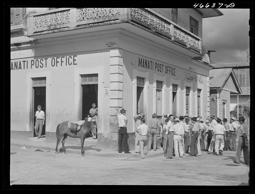 [Untitled photo, possibly related to: Manati, Puerto Rico. Waiting for WPA (Work Projects Administration) paychecks at the…