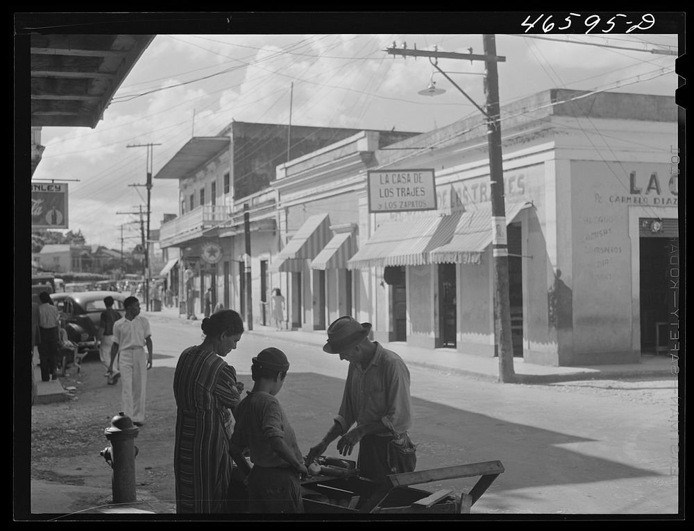[Untitled photo, possibly related to: Manati, Puerto Rico. Street in the shopping district]. Sourced from the Library of…