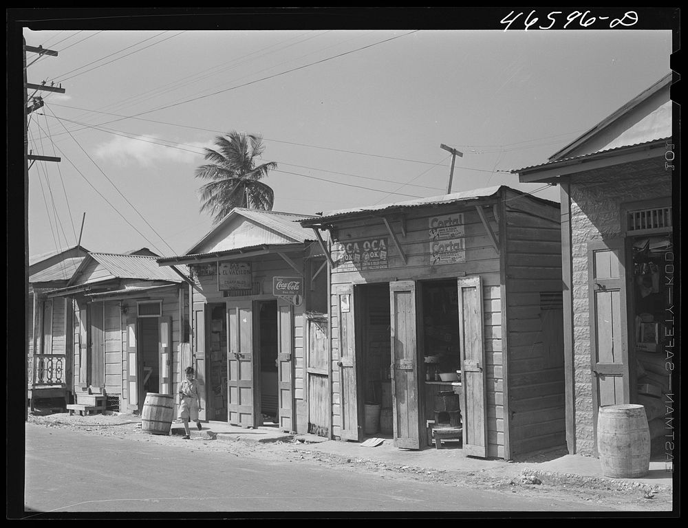 Manati, Puerto Rico (vicinity). A row of grocery stores. Sourced from the Library of Congress.
