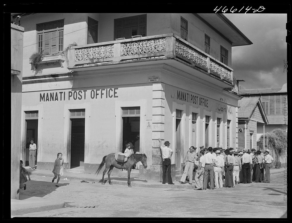 Manati, Puerto Rico. Waiting for WPA (Work Projects Administration) paychecks at the post office. Sourced from the Library…