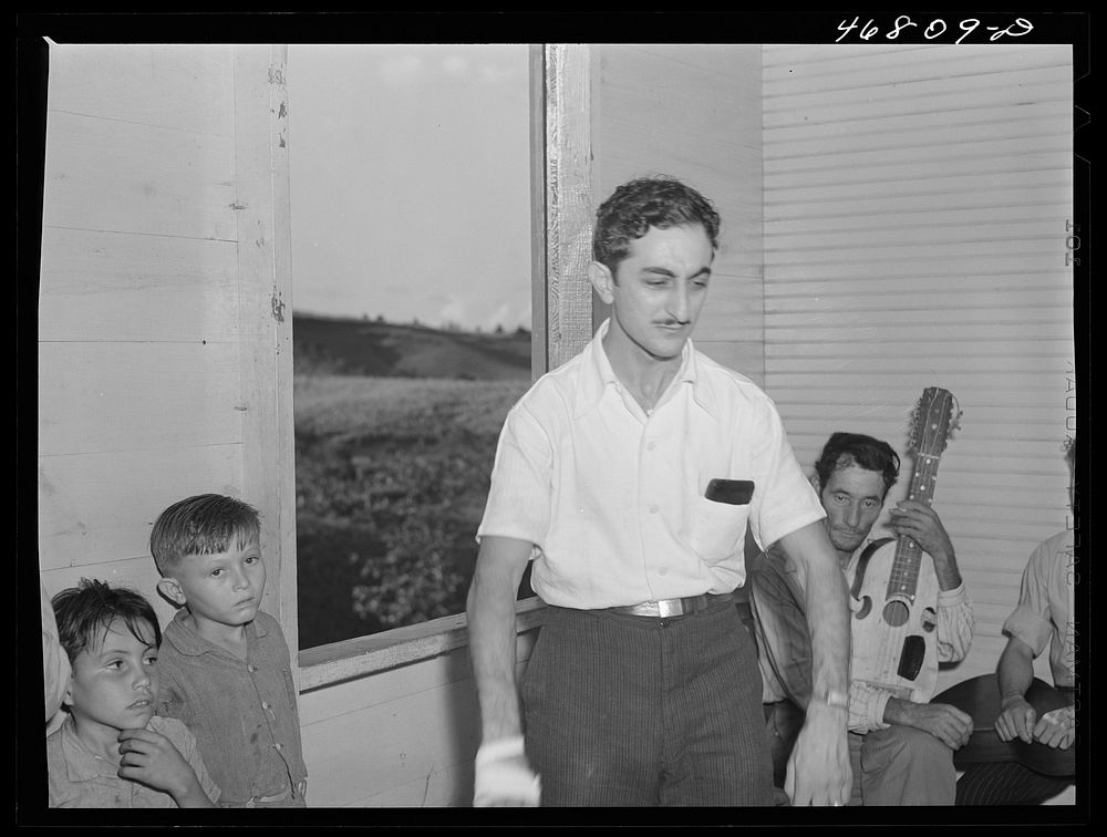 [Untitled photo, possibly related to: Corozal, Puerto Rico (vicinity). Principal of a nearby school reciting a poem at the…