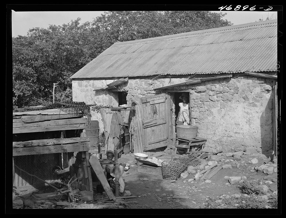 [Untitled photo, possibly related to: Saint John, Saint Croix Island, Virgin Islands. Village house divided off into rooms…