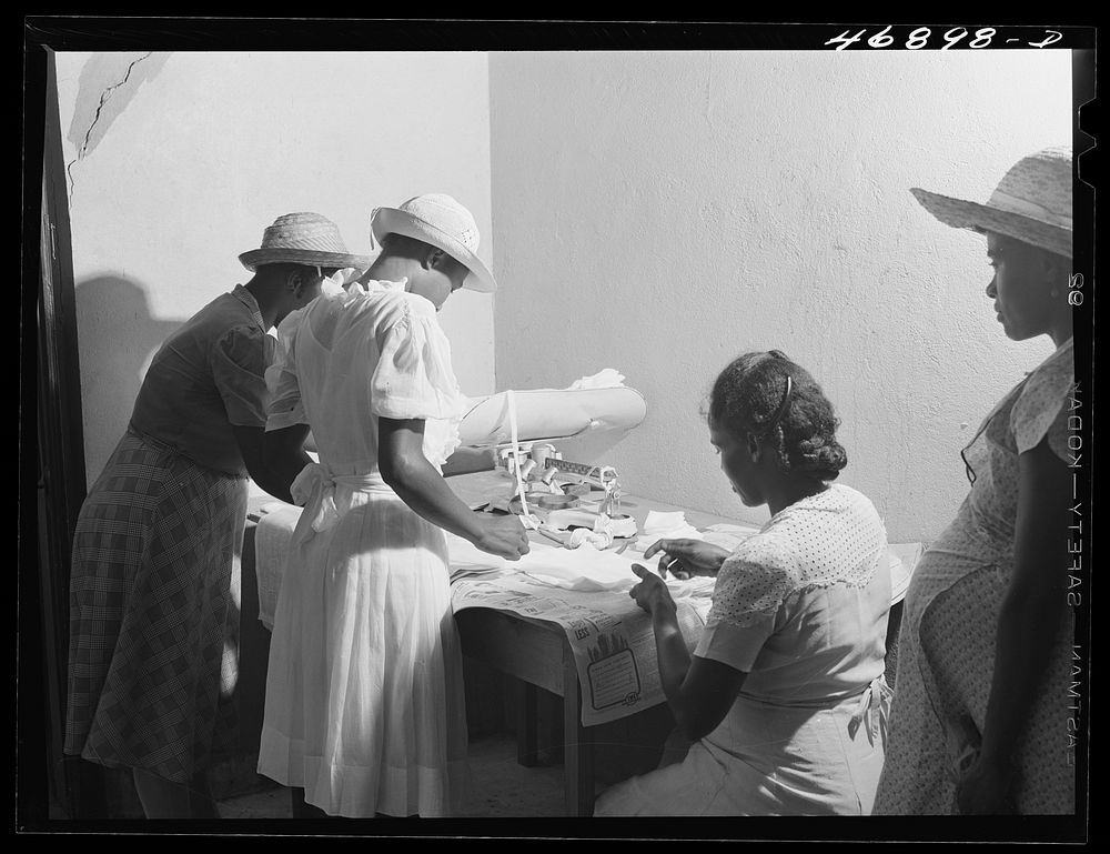 Prederiksted, Saint Croix Island, Virgin Islands (vicinity). Preparing surgical dressings at a health clinic. Sourced from…