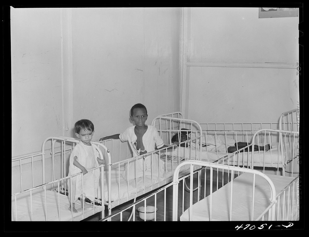 Frederiksted, Saint Croix, Virgin Islands. Child on the left, in the children's ward of the Frederiksted hospital, is…