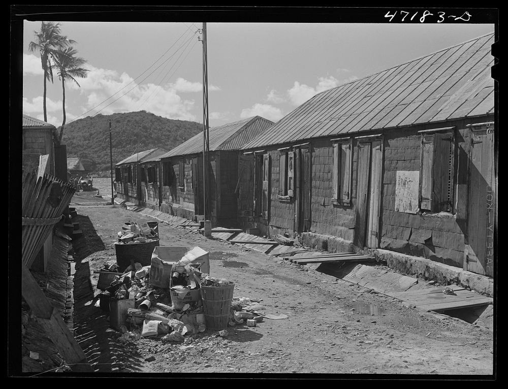 Charlotte Amalie, Saint Thomas Island, Virgin Islands. A group of long row houses near the water front. Sourced from the…