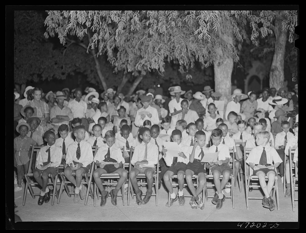 [Untitled photo, possibly related to: Charlotte Amalie, Saint Thomas Island, Virgin Islands. Choir singing Christmas carols…