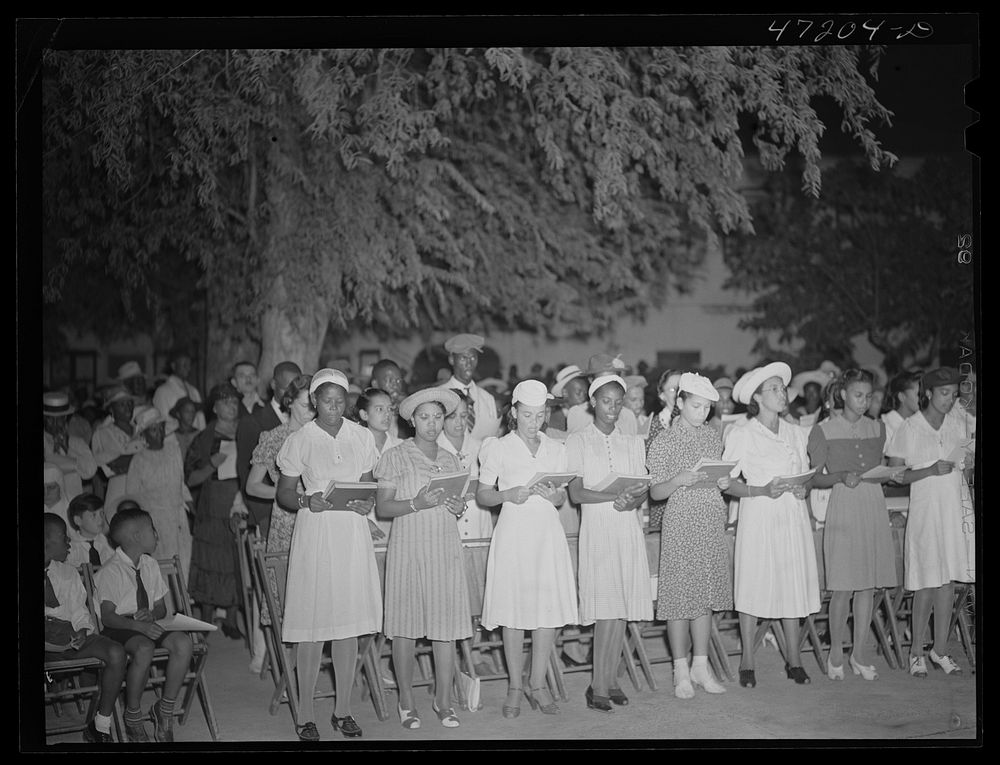 Charlotte Amalie, Saint Thomas Island, Virgin Islands. Choir singing Christmas carols at the Red Cross meeting held in the…