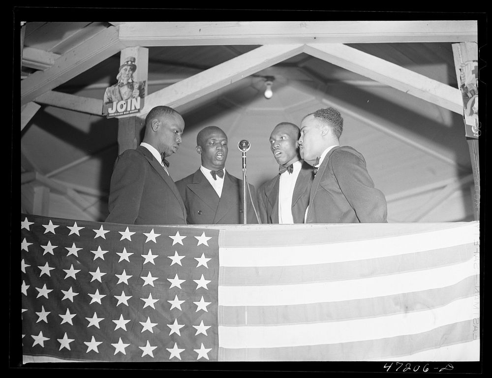 Charlotte Amalie, Saint Thomas Island, Virgin Islands. A quartette singing at the Red Cross meeting held in the square.…