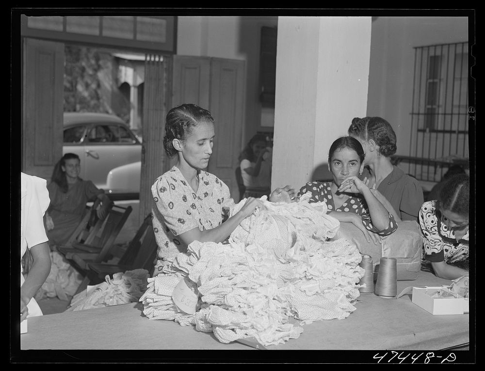 [Untitled photo, possibly related to: Santurce, Puerto Rico. Women working in the Rodriguez needlework factory where the…