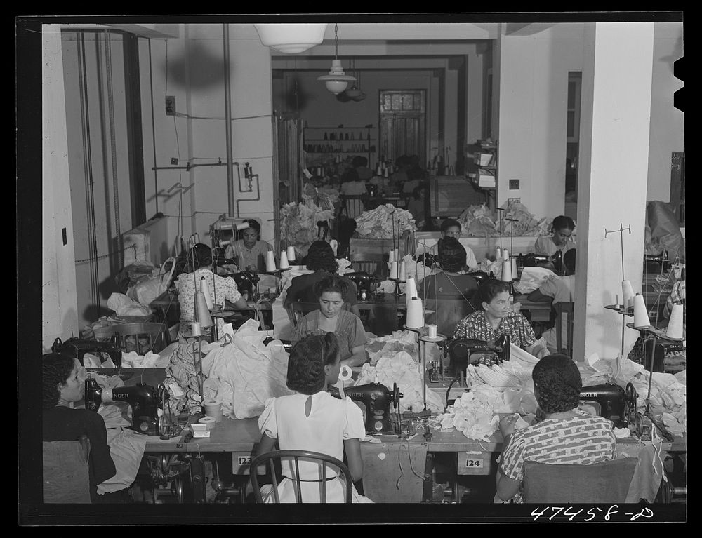 Santurce, Puerto Rico. Women working at the Rodriguez needlework factory. Minimum wage is six dollars a week. Sourced from…