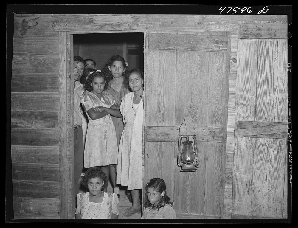 [Untitled photo, possibly related to: Guanica, Puerto Rico (vicinity) A Three Kings' eve party at the home of a farm labor…