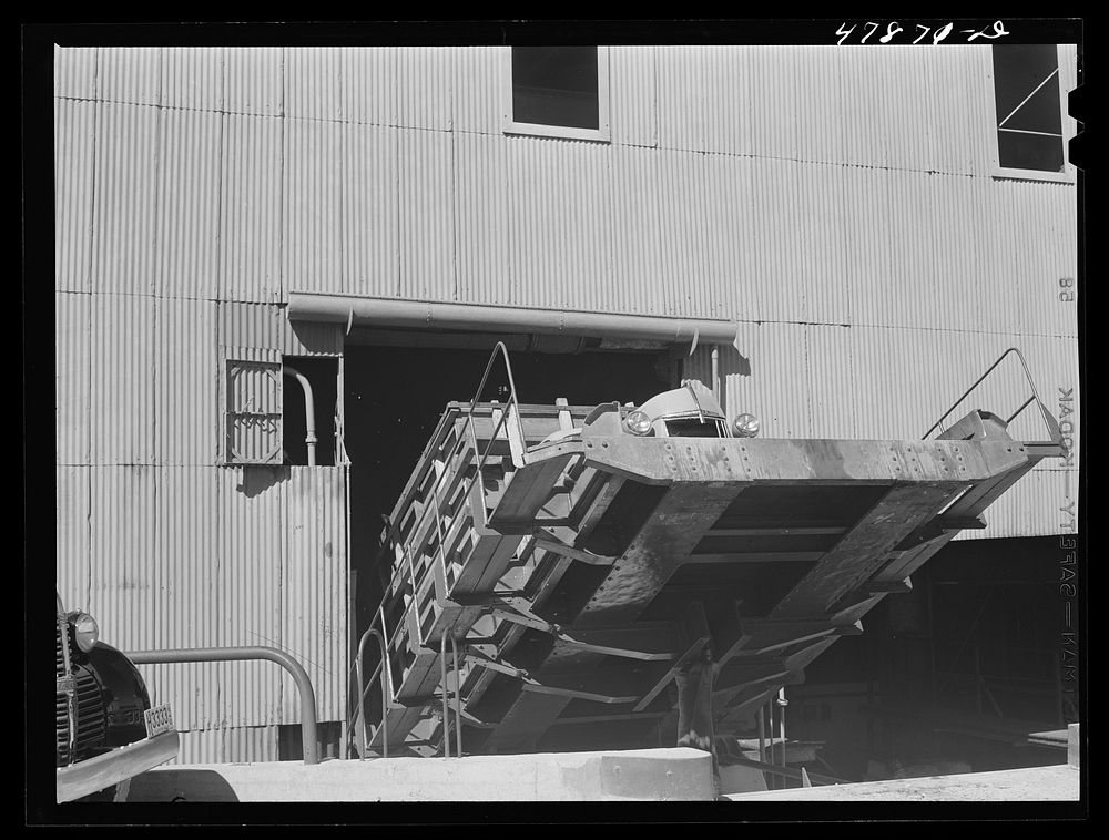 [Untitled photo, possibly related to: Ensenada, Puerto Rico. Apparatus for tilting the truck in order to slide the sugar…