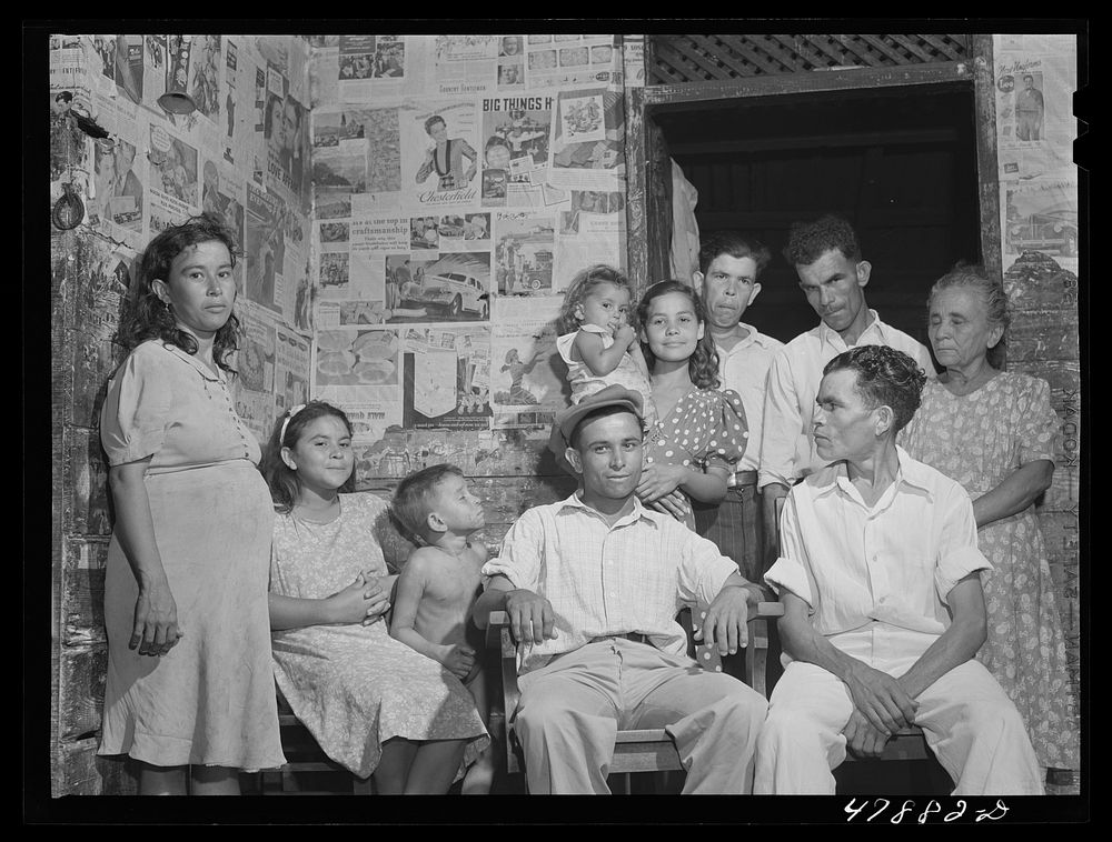 Guayanilla, Puerto Rico. Family of a sugar worker living in one of the company houses behind the mill. All these people live…
