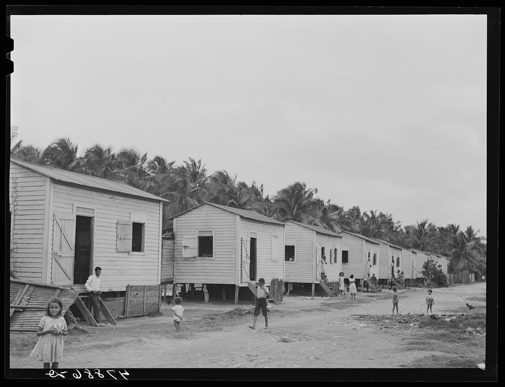 Guayanilla, Puerto Rico. Houses in a company village behind a sugar mill. Sourced from the Library of Congress.