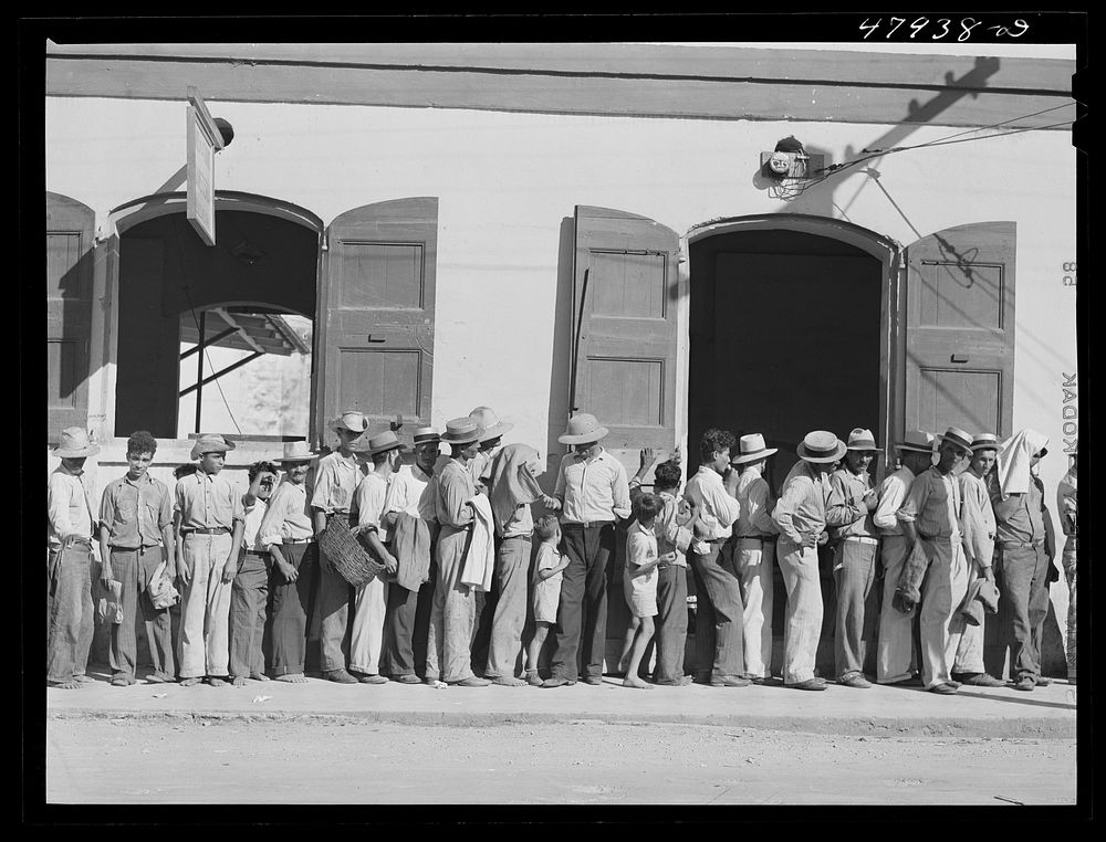 Cabo Rojo, Puerto Rico. Waiting in line at the surplus commodities office. Fatback and meal were distributed that day.…