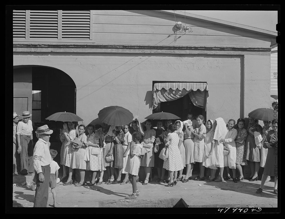 [Untitled photo, possibly related to: Cabo Rojo, Puerto Rico. Waiting in line to get surplus commodities. They were…