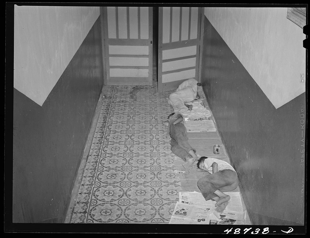 [Untitled photo, possibly related to: Caguas, Puerto Rico. Homeless people sleeping in the hallway of an apartment house].…
