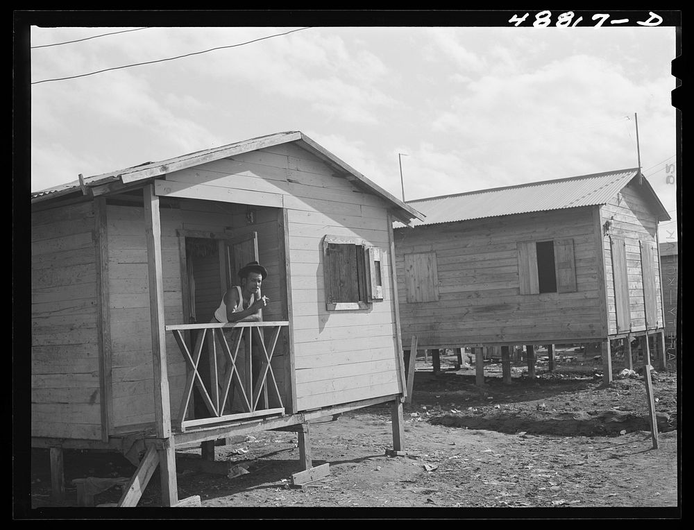 [Untitled photo, possibly related to: San Juan, Puerto Rico. Worker from the naval base in San Juan who lives in this house…
