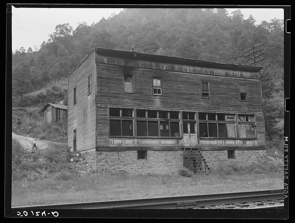 Old company store in abandoned coal mining town. Marine, West Virginia. The store is occupied by three families. Sourced…