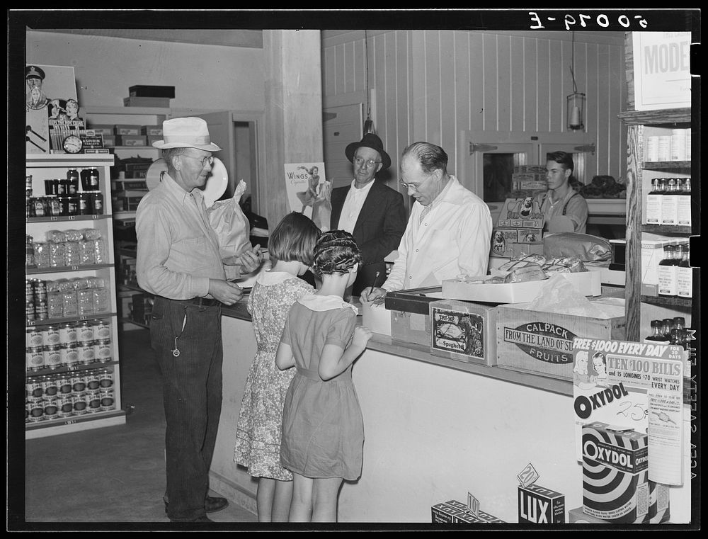 Buying groceries in community store. Tygart Valley, West Virginia. Sourced from the Library of Congress.