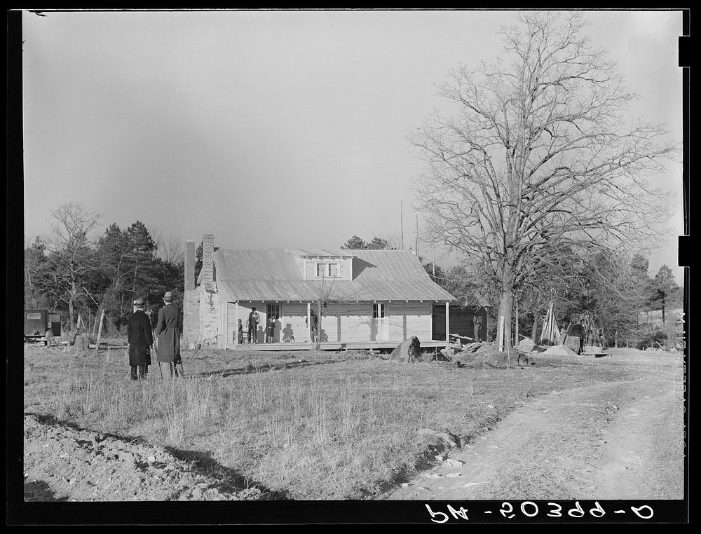 [Untitled photo, possibly related to:  family (rehabilitation clients) on porch of new home they are building near Raleigh…