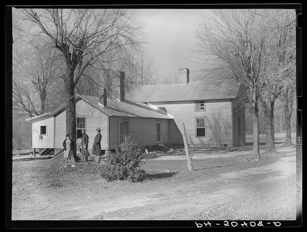 Rear view of home being remodeled for rehabilitation client, showing new addition on left. Near Raleigh, North Carolina.…