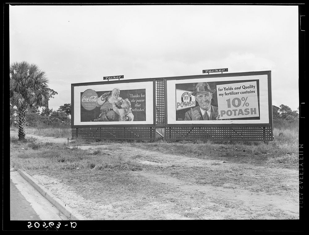 Highway signboard, advertising two of the South's and Florida's standbys. Sourced from the Library of Congress.