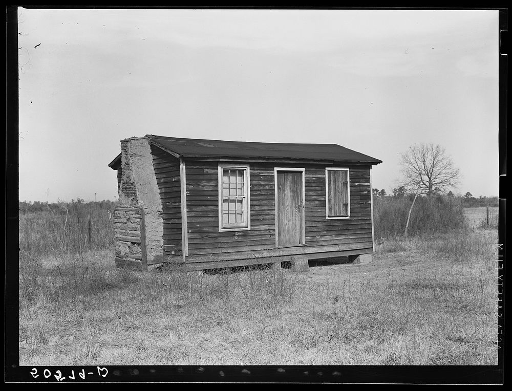 Home of Indian family (mixed breed) not yet resettled on Pembroke Farms. North Carolina, near Maxton. Sourced from the…