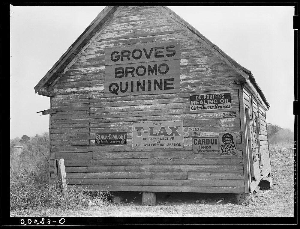 Advertising Bromo-Quinine used in South for malaria and other "remedies" on side of old shack near Summerville, South…