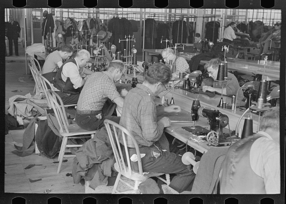 [Untitled photo, possibly related to: Some of the operators at the Jersey Homesteads garment factory working at their…