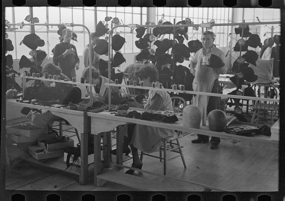 Homesteaders' daughters are employed in the millinery department of the cooperative garment factory at Jersey Homesteads…