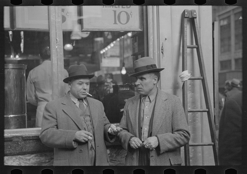 [Untitled photo, possibly related to: Two men in conversation, 7th Avenue near 38th Street, New York City] by Russell Lee