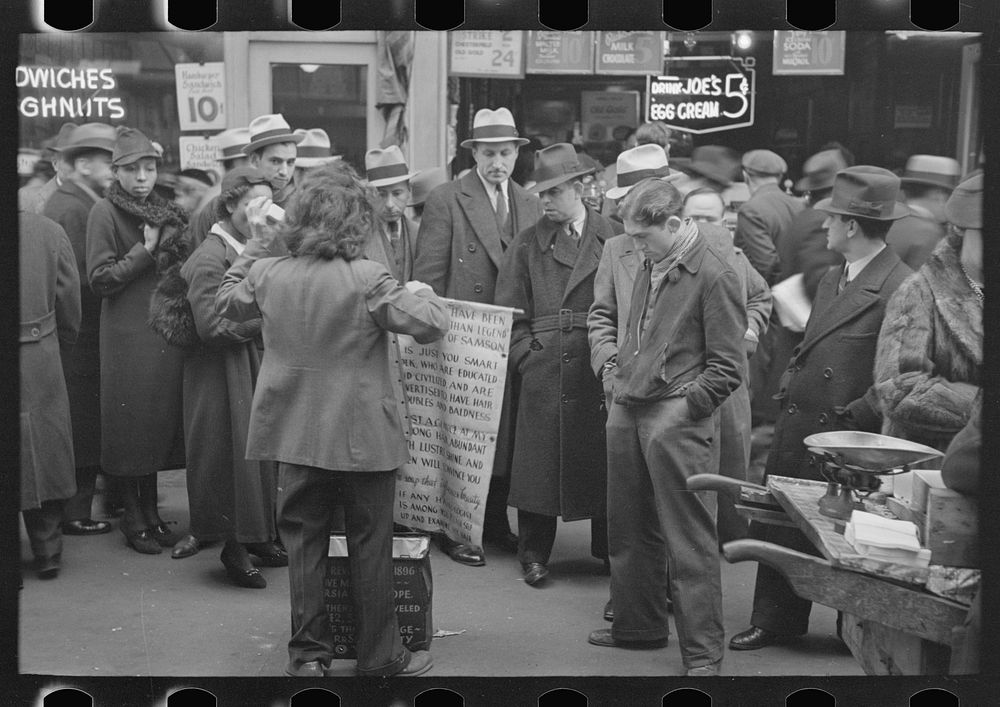 Hair tonic salesman advertising his wares, 7th Avenue at 38 Street, New York City by Russell Lee