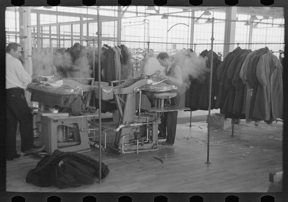 Steam pressing the cloth is one process in manufacturing women's coats at Jersey Homesteads, Hightstown by Russell Lee
