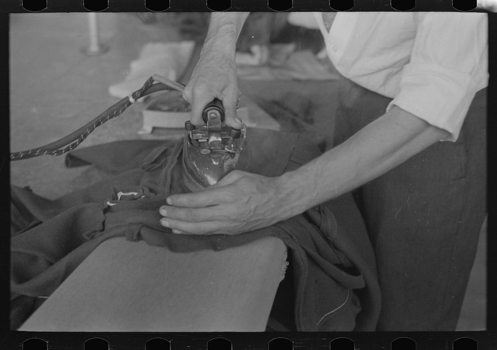[Untitled photo, possibly related to: Closeup of presser's hands, Jersey Homesteads factory, Hightstown, New Jersey] by…
