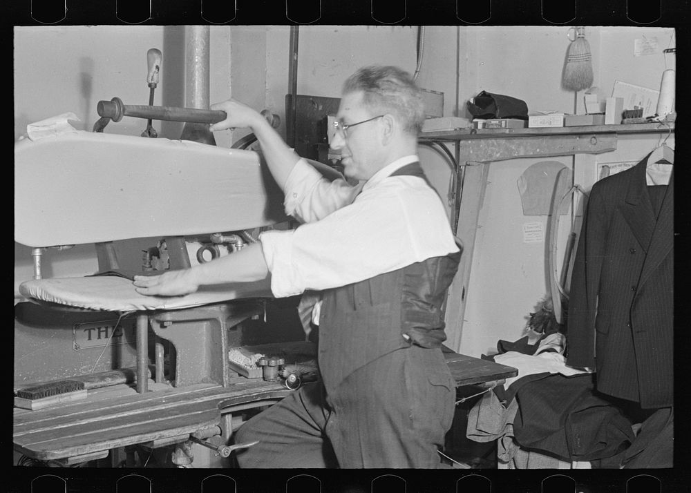 [Untitled photo, possibly related to: Proprietor of tailor shop at steam presser, University Place near 11th Street, New…