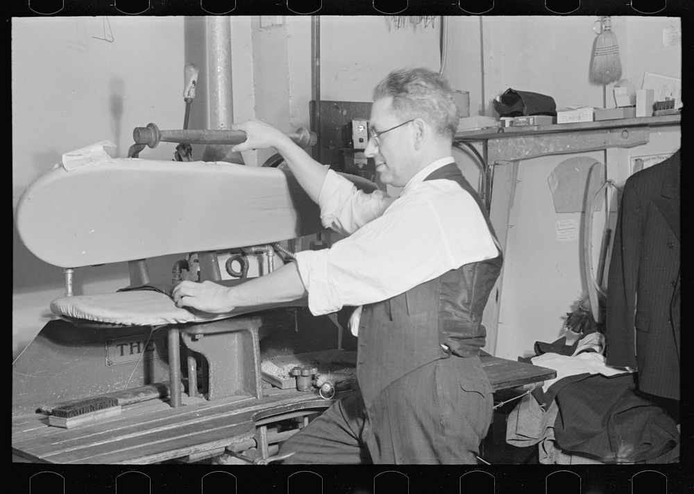 Proprietor of tailor shop at steam presser, University Place near 11th Street, New York City by Russell Lee