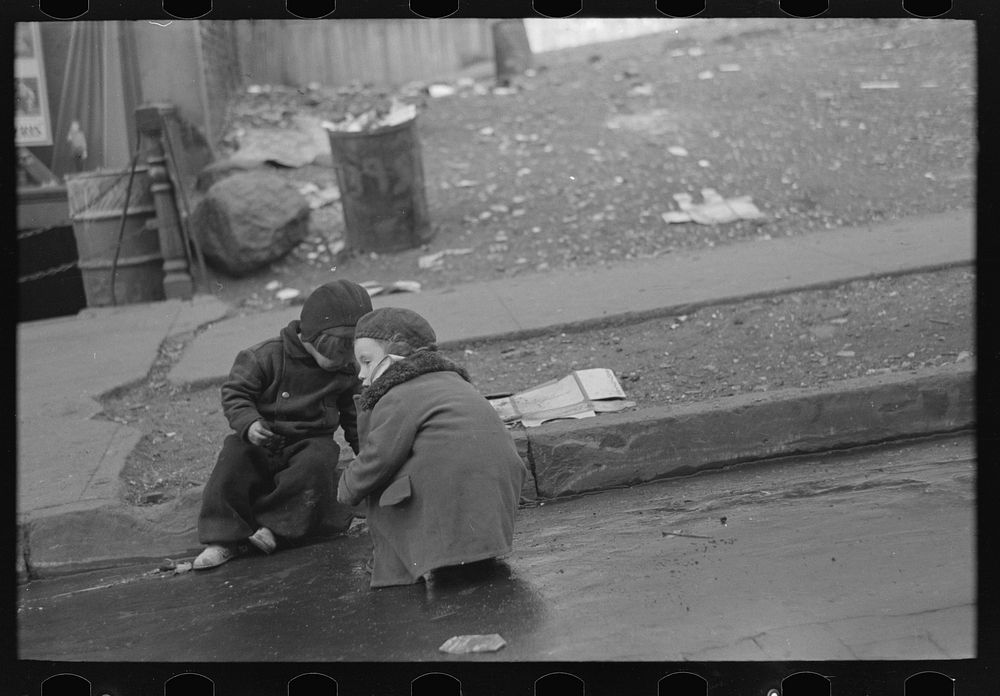 Children playing in the gutter on 139th Street just east of St. Anne's Avenue, Bronx, New York by Russell Lee