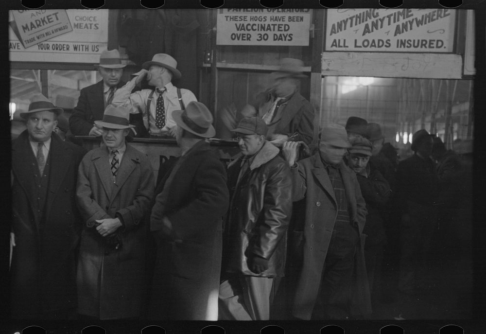 [Untitled photo, possibly related to: Farmers sitting inside sales ring of livestock sales hall Ames, Iowa] by Russell Lee