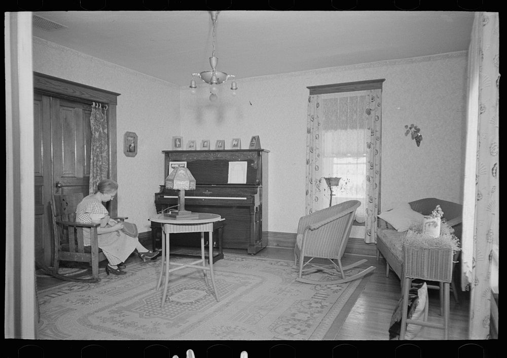 [Untitled photo, possibly related to: Living room of Levi Mills farmhouse near Spencer, Iowa. This eighty acre farm is…