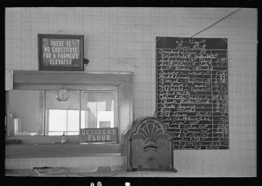 Signs in a cooperative elevator at Ruthven, Iowa by Russell Lee