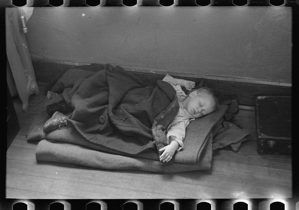 Young flood refugee asleep in schoolhouse, Sikeston, Missouri by Russell Lee