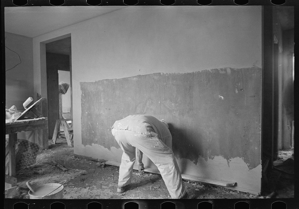 [Untitled photo, possibly related to: Man plastering wall in Greenhills, Ohio house] by Russell Lee